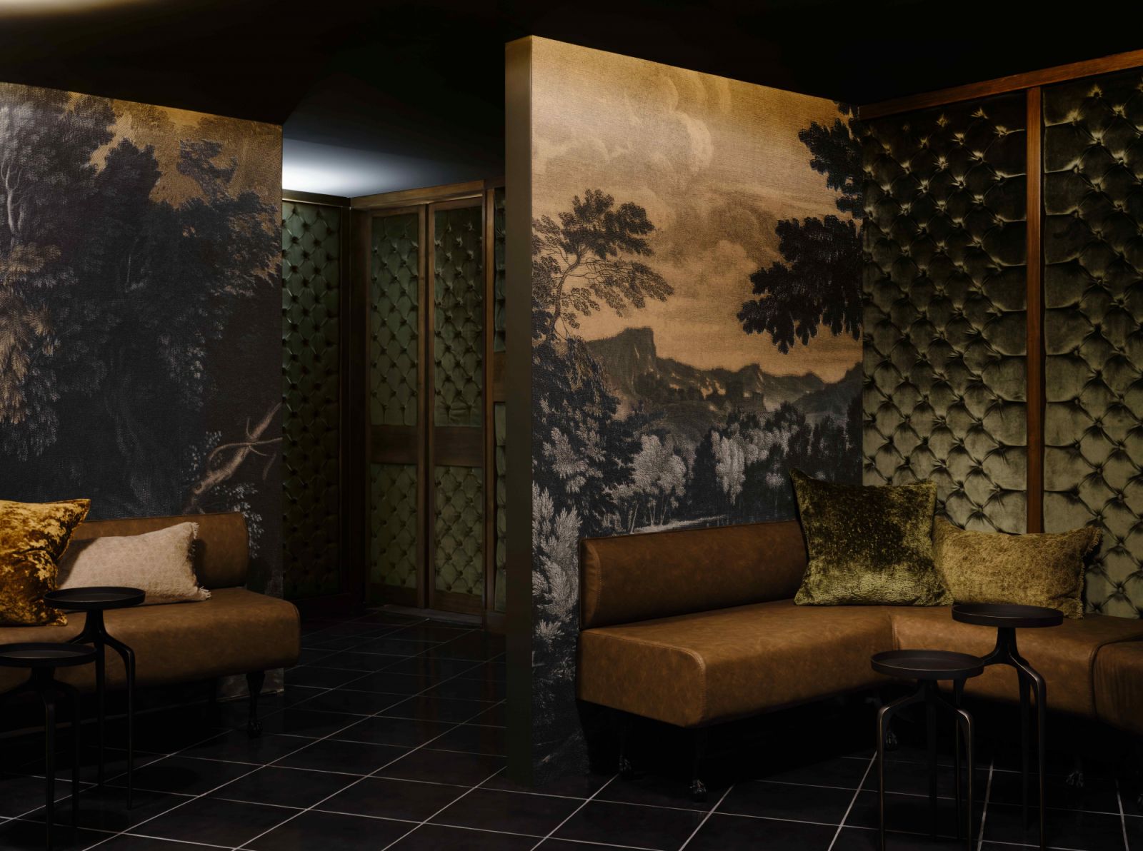The underground antechamber adorned with tufted velvet walls and rich wallpaper