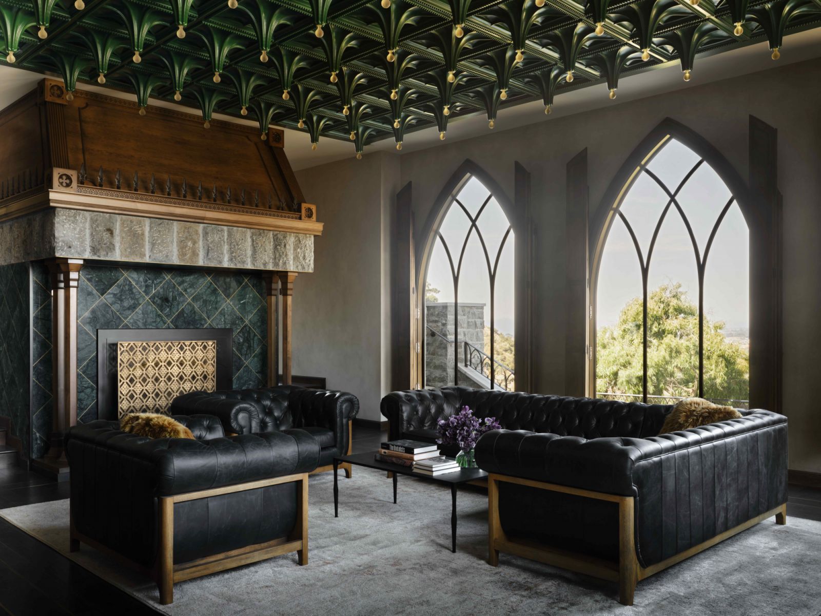 The grand fireplace is crafted from stone imported from international quarries