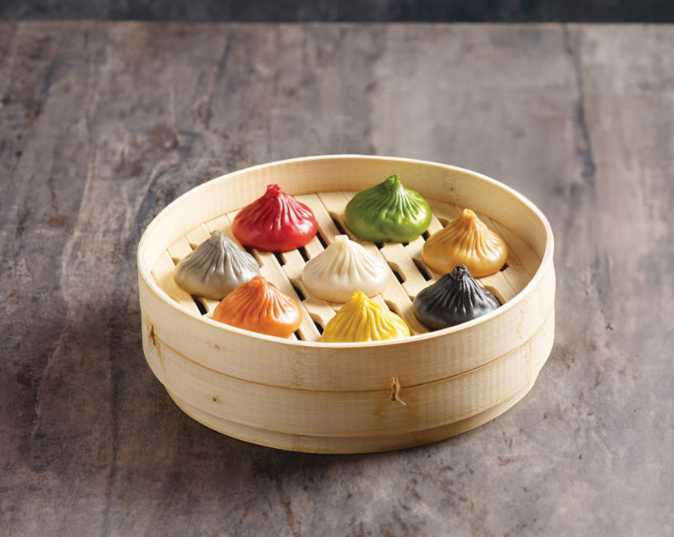 Paradise Dynasty's 'Signature Dynasty xiao long bao', a selection of eight colourful flavours including original, Korean kimchi, foie gras, black truffle, cheese, crab roe, garlic and Szechuan.