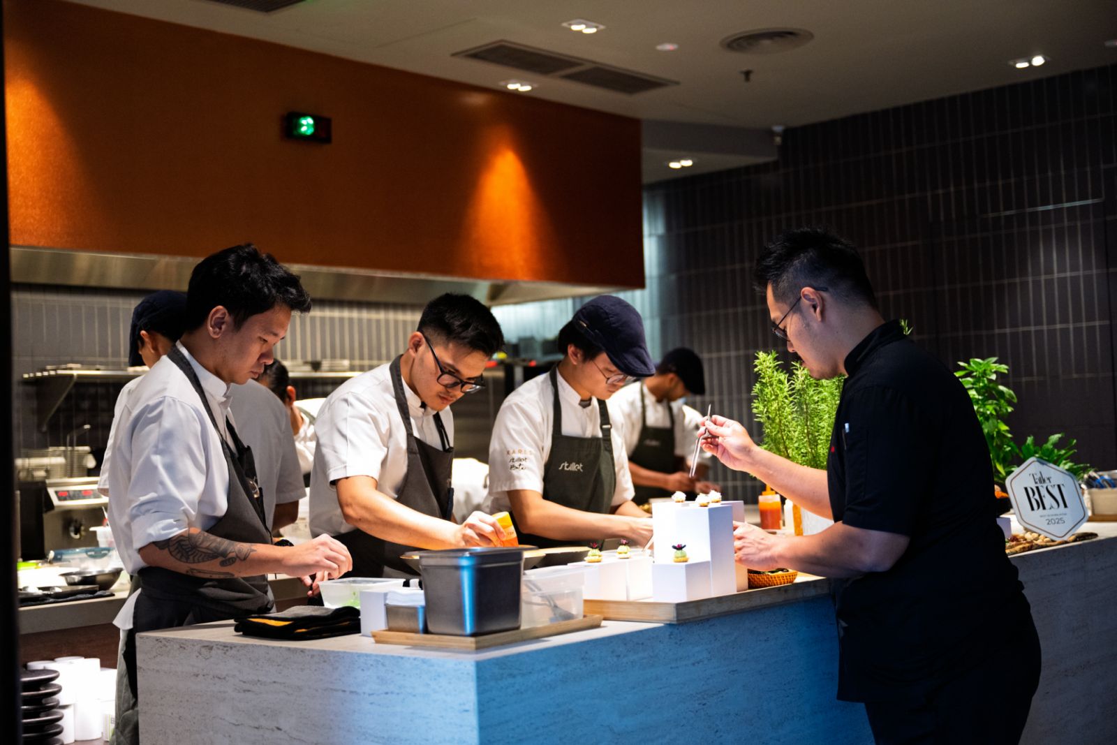 Chef Hans and Chef Raymond with their teams