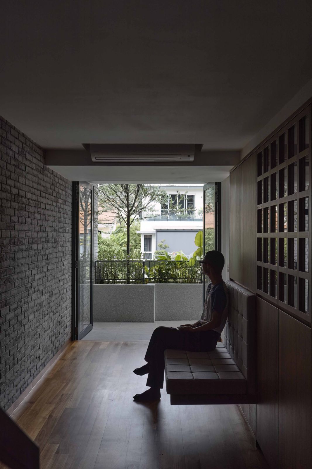 A built-in seating in this corridor allows one to pause and enjoy the space.