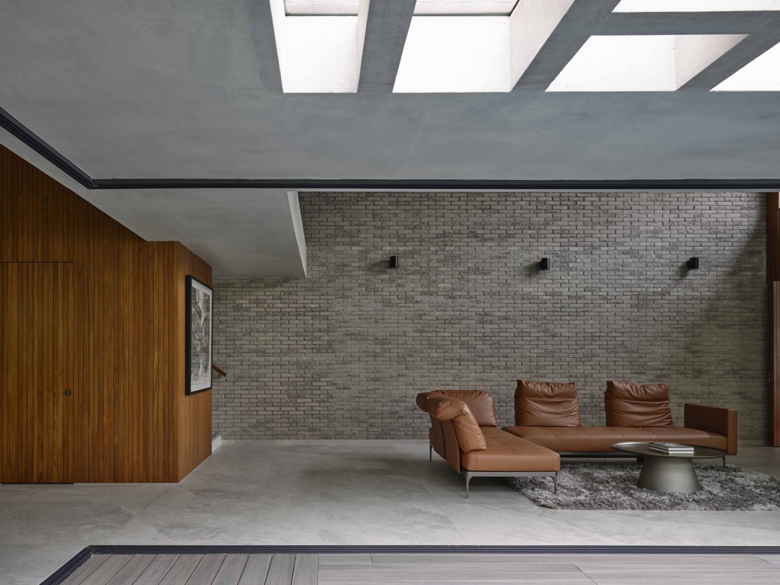 The poolside living room can be completely opened to the elements