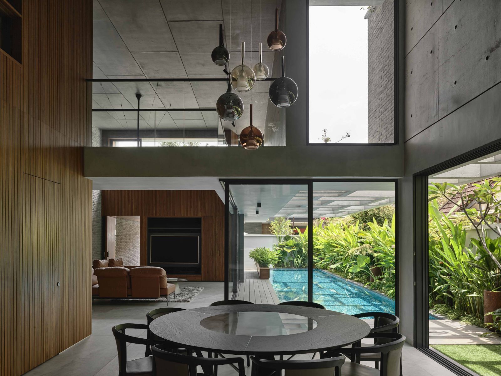 The semi-detached house’s porous architecture is evident from this view of the dining area