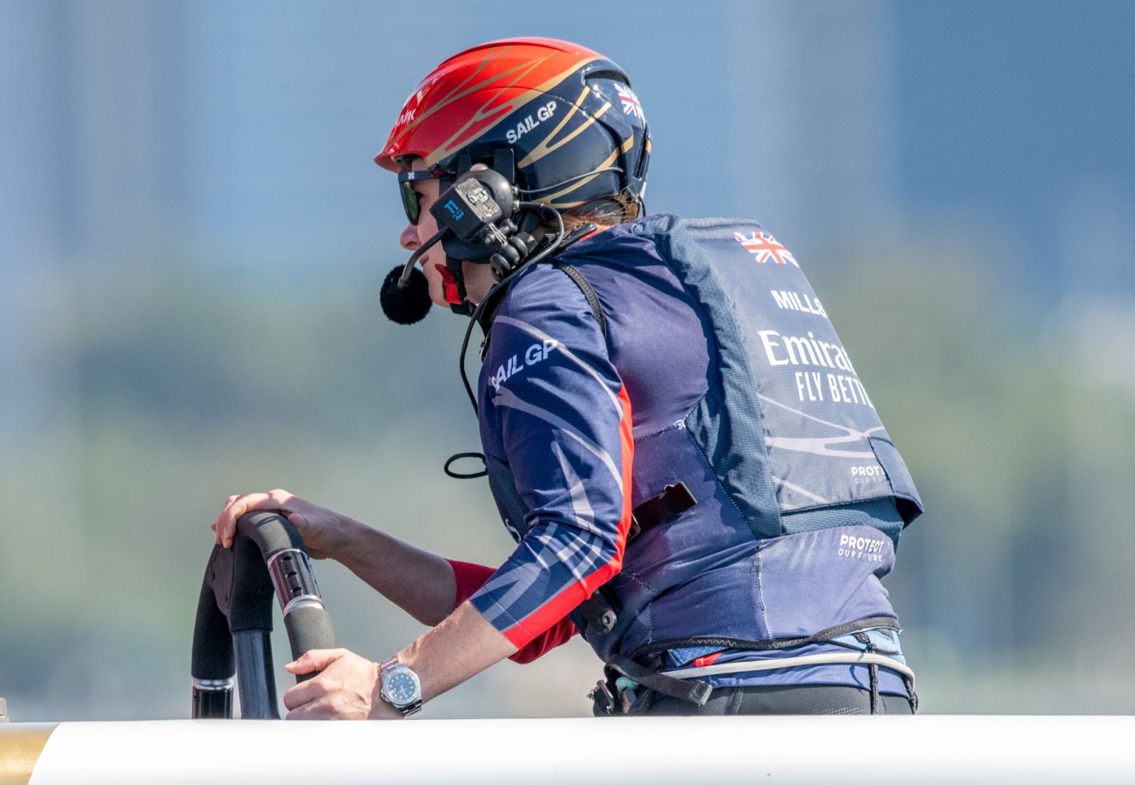 Hannah Mills, strategist of Emirates Great Britain SailGP Team, behind the wheel as the Emirates Great Britain SailGP Team host a Women’s Pathway Program training session ahead of the Mubadala Abu Dhabi Sail Grand Prix presented by Abu Dhabi Sports Council in Abu Dhabi, United Arab Emirates. 11th January 2024. Photo: Ricardo Pinto for SailGP. Handout image supplied by SailGP
