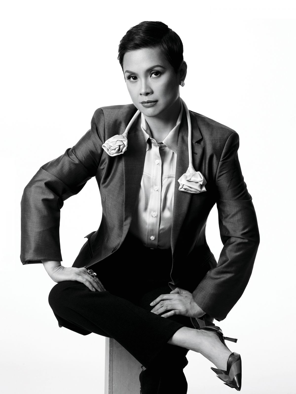 Salonga wears Prada suit jacket, shirt and shoes, Rajo Laurel pants and Brent Neale earrings