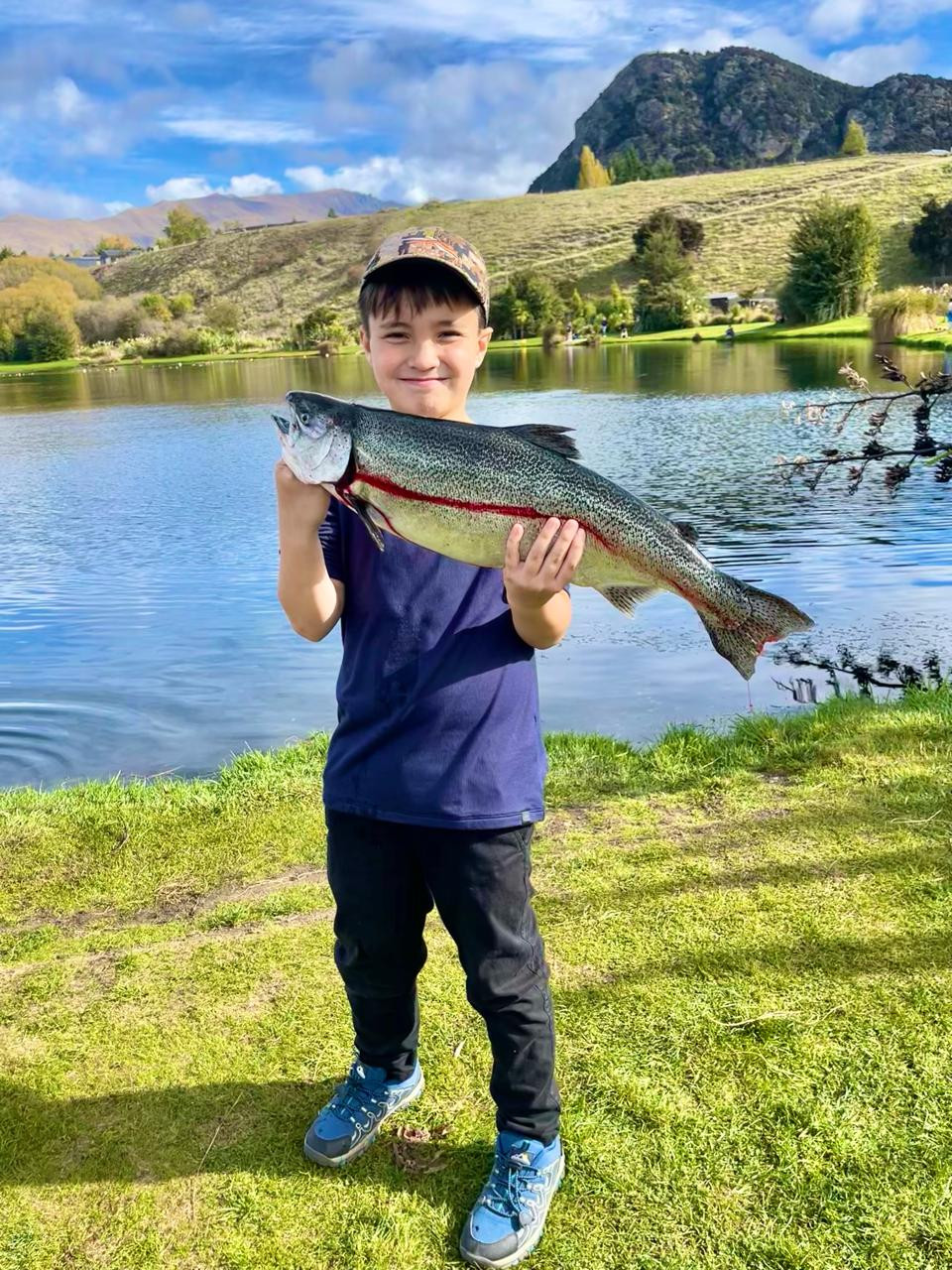 Santi showing off his catch and our lunch for the day (Photo: Courtesy of Audrey Tan Zubiri)