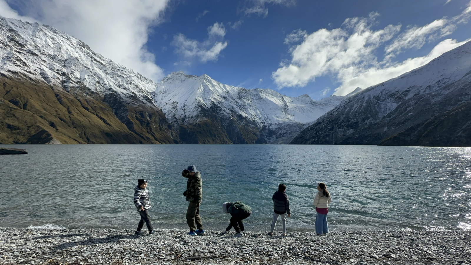 The young ones enjoying the simple art of stone skipping on a mountaintop lake (Photo: Courtesy of Audrey Tan Zubiri)