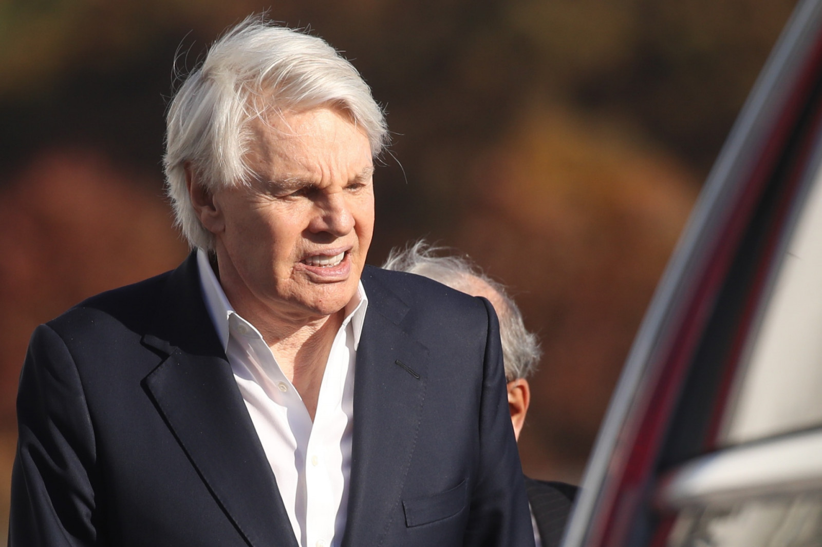 CENTRAL ISLIP, NEW YORK - OCTOBER 25: Former Abercrombie & Fitch CEO Mike Jeffries leaves a Long Island court with members of his legal team after pleading not guilty to sex-trafficking charges allegedly involving young male models on October 25, 2024 in Central Islip, New York. Jeffries, who is 80, was released on a $10 million bond and answered to 16 counts against him. (Photo by Spencer Platt/Getty Images)
