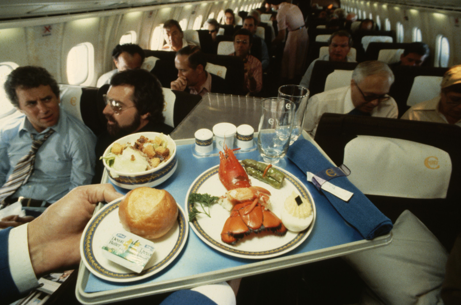 A lobster dinner on the Concorde, as the plane flies over the Atlantic Ocean. (Photo by Jim Sugar/Corbis via Getty Images)