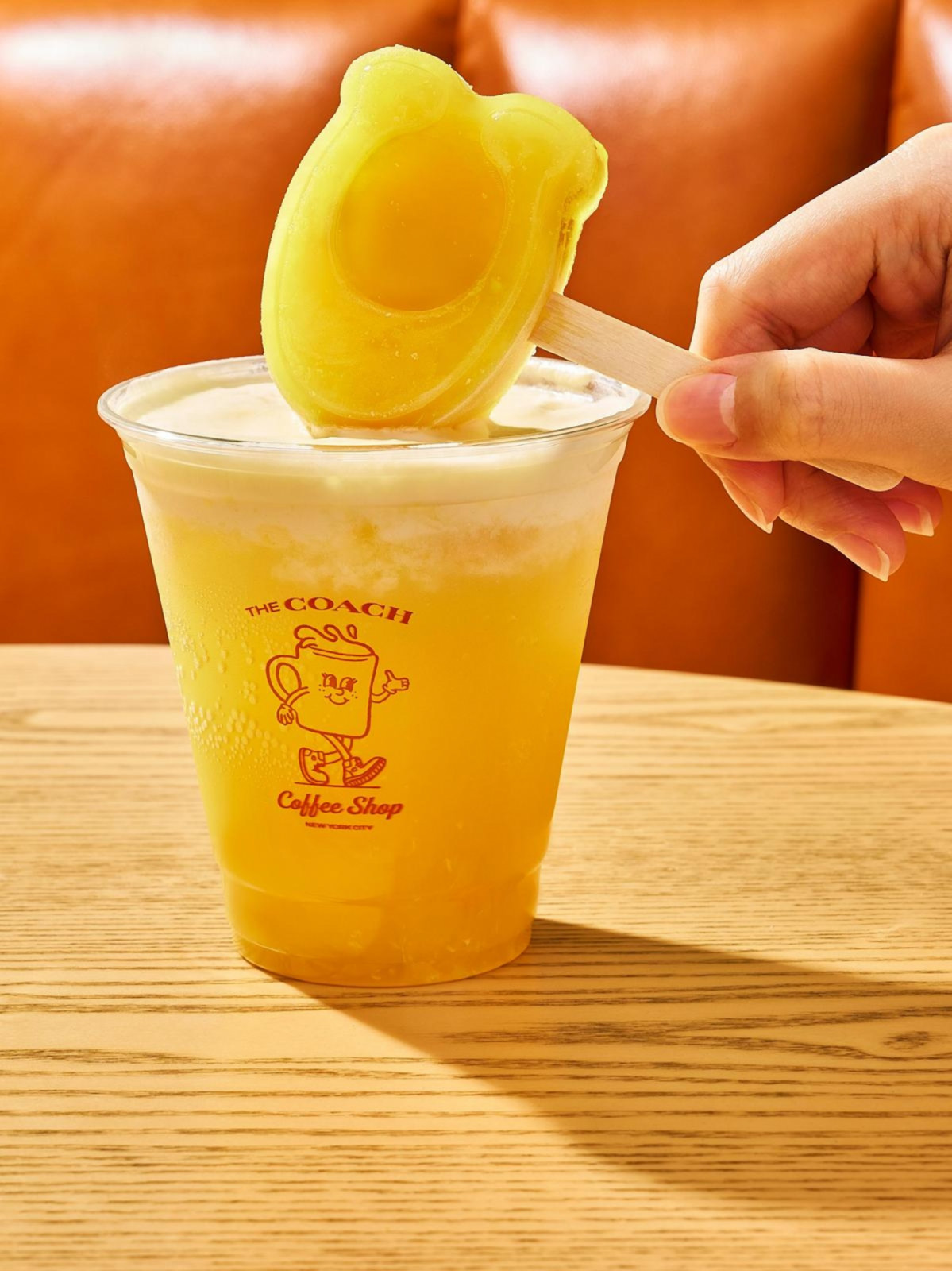 Tangy orange fizz and orange vanilla cream with C-shaped orange icicles Coach Coffee Shop Singapore Resort World Sentosa