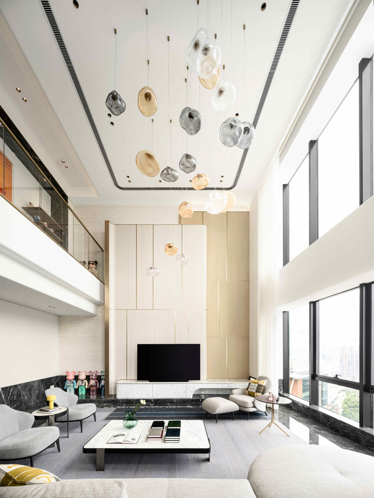 The airy, double-volume living room maximises natural light and enhances air circulation