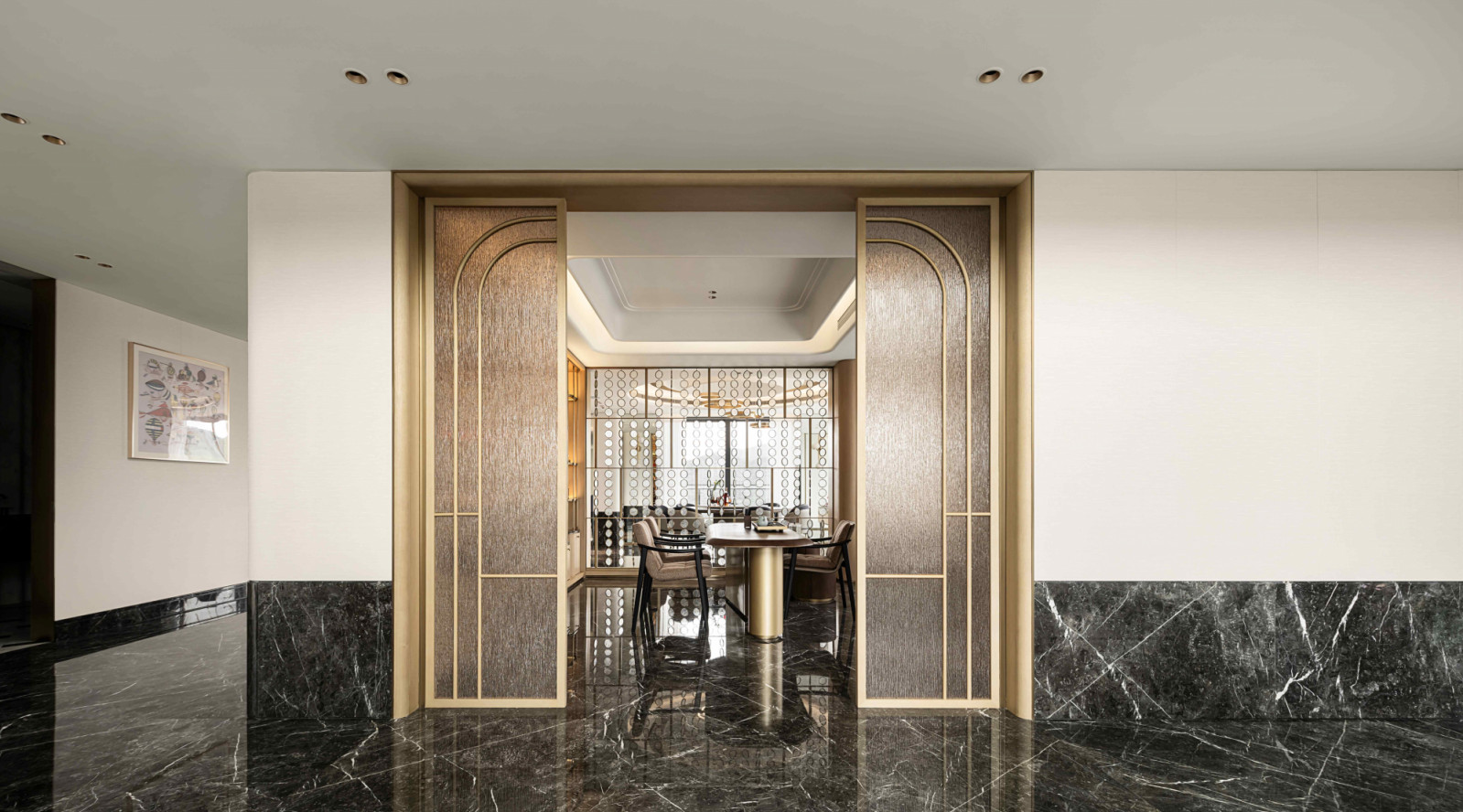 Dark marble flooring permeates the lower level for a sense of harmony