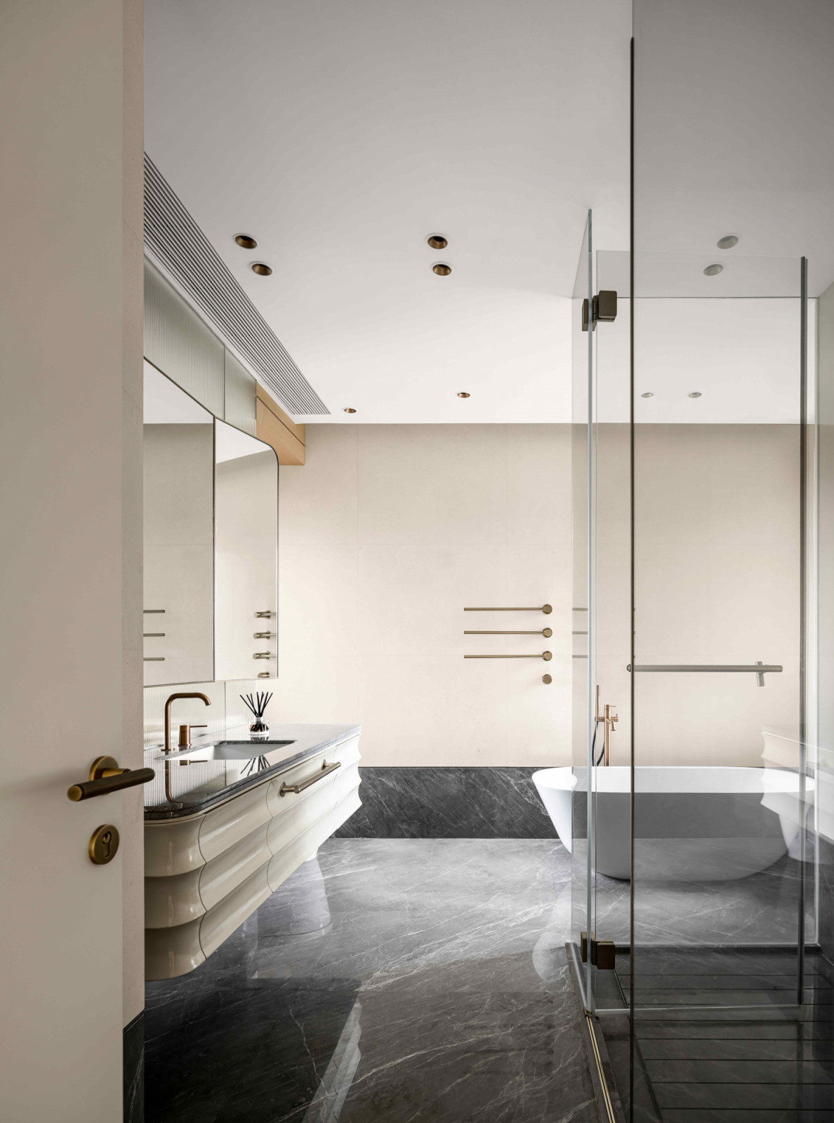 Softened curves evoke a sense of tranquility in the bathroom
