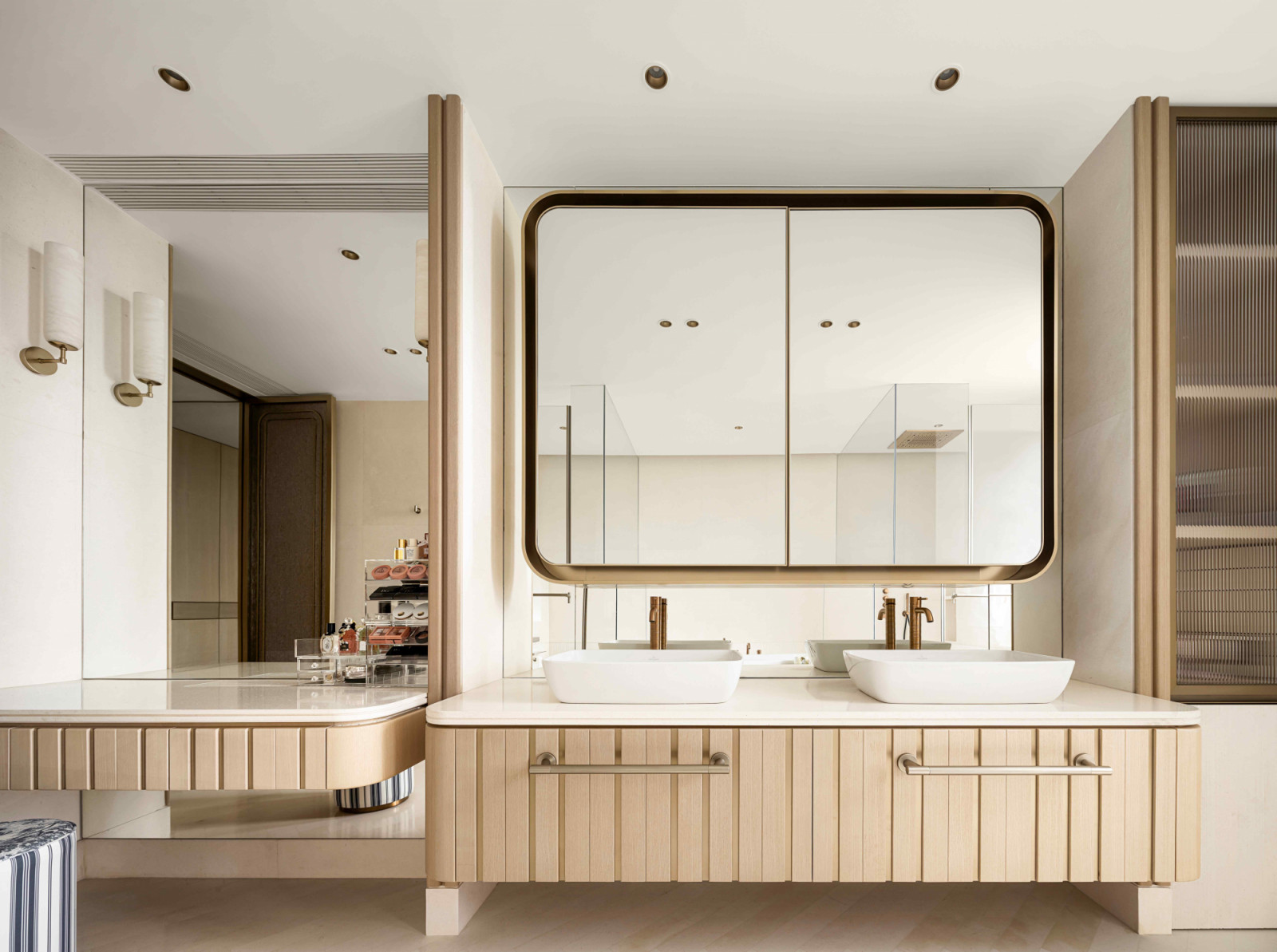 The primary bathroom features modern and traditional materials converging effortlessly