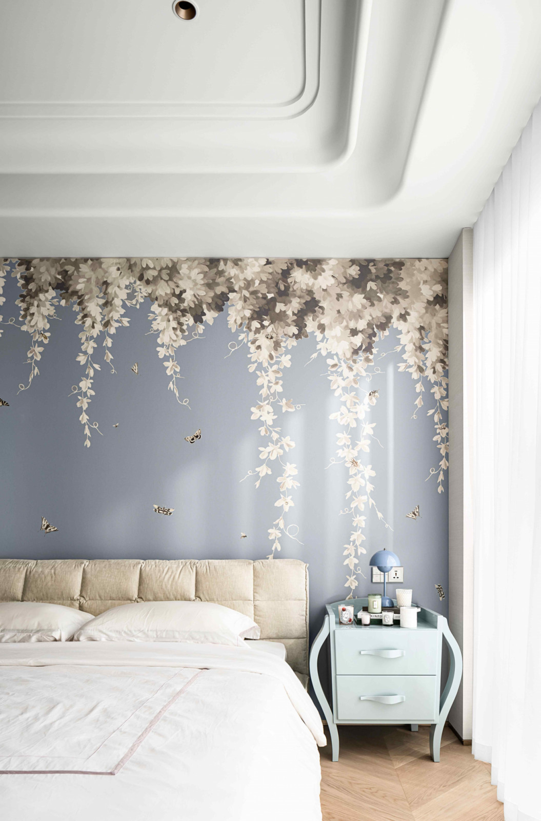 The pastel-toned bedrooms exude a refined and curated ambiance reminiscent of a luxury boutique on the Champs-Élysées