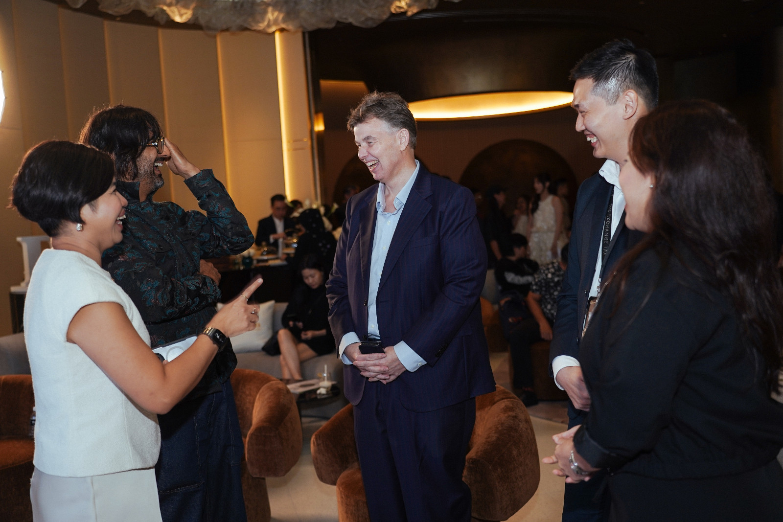 Trevor Hill, general manager of The Exchange TRX (centre), chatting with Tej Chauhan