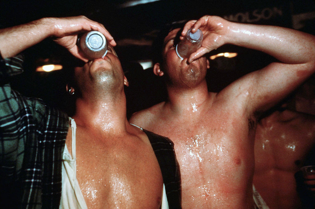 Two Men Binge Drinking at a Party (Photo by © Andrew Lichtenstein/CORBIS/Corbis via Getty Images)