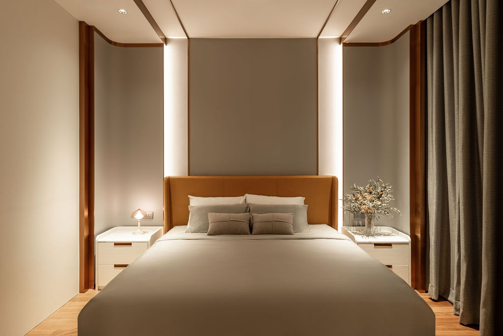 A master bedroom featuring the timber flooring on the upper level that, while warmer in tone than the ground floor stone, requires more maintenance