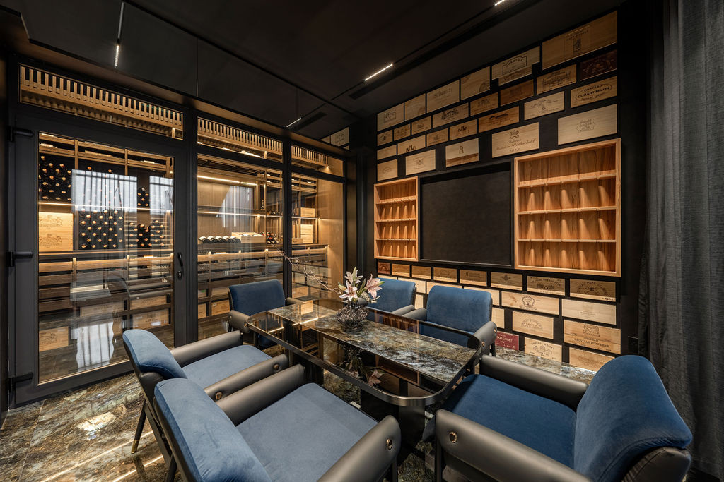 The custom wine room evolved from simple storage into what architect Ken Tiu calls “a feature space for gatherings,” now central to the homeowners’ entertaining.