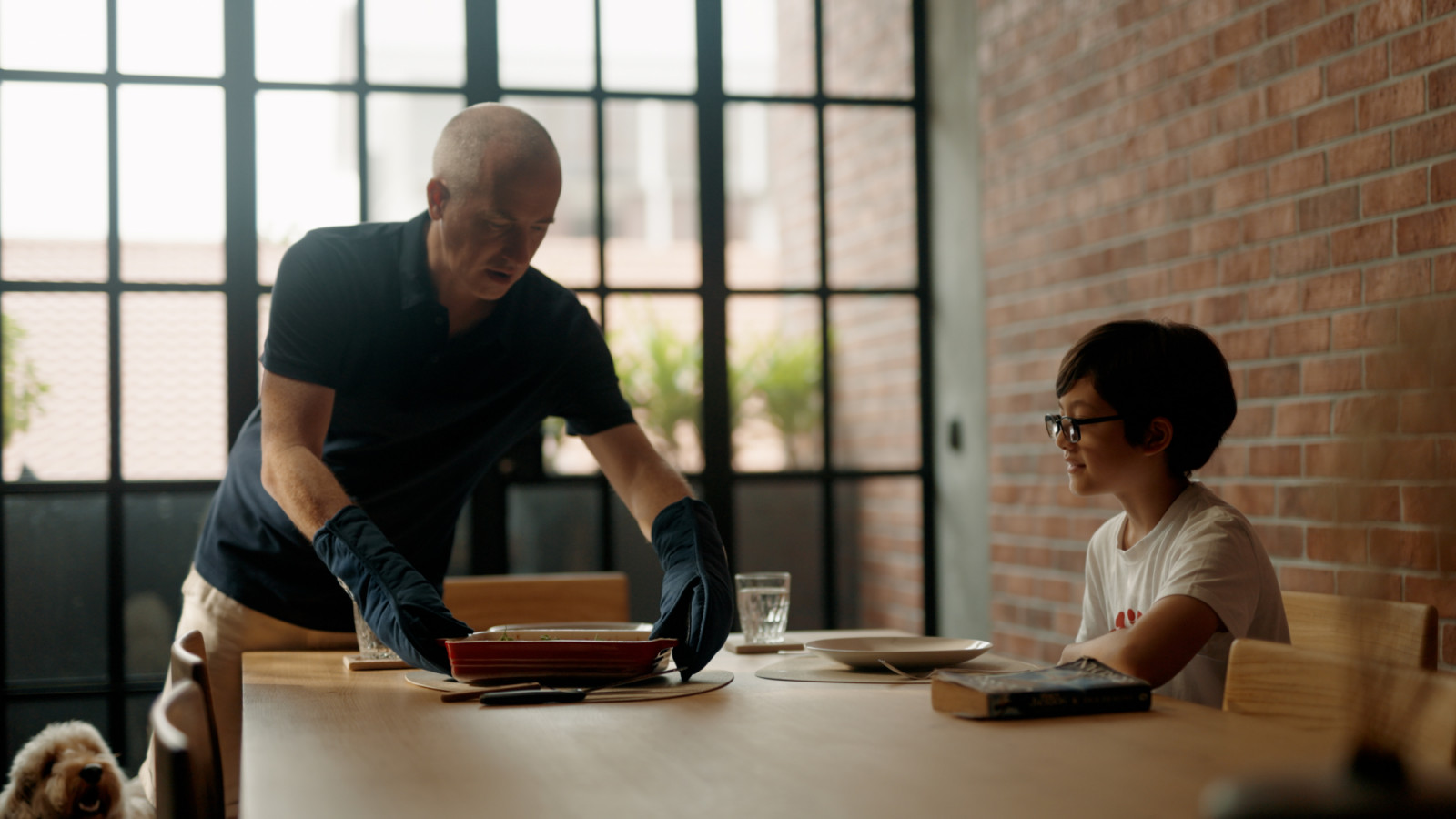 David and his son Ptolemy gather around the dining table—one of many moments shaped by the functionality and flow of their new kitchen