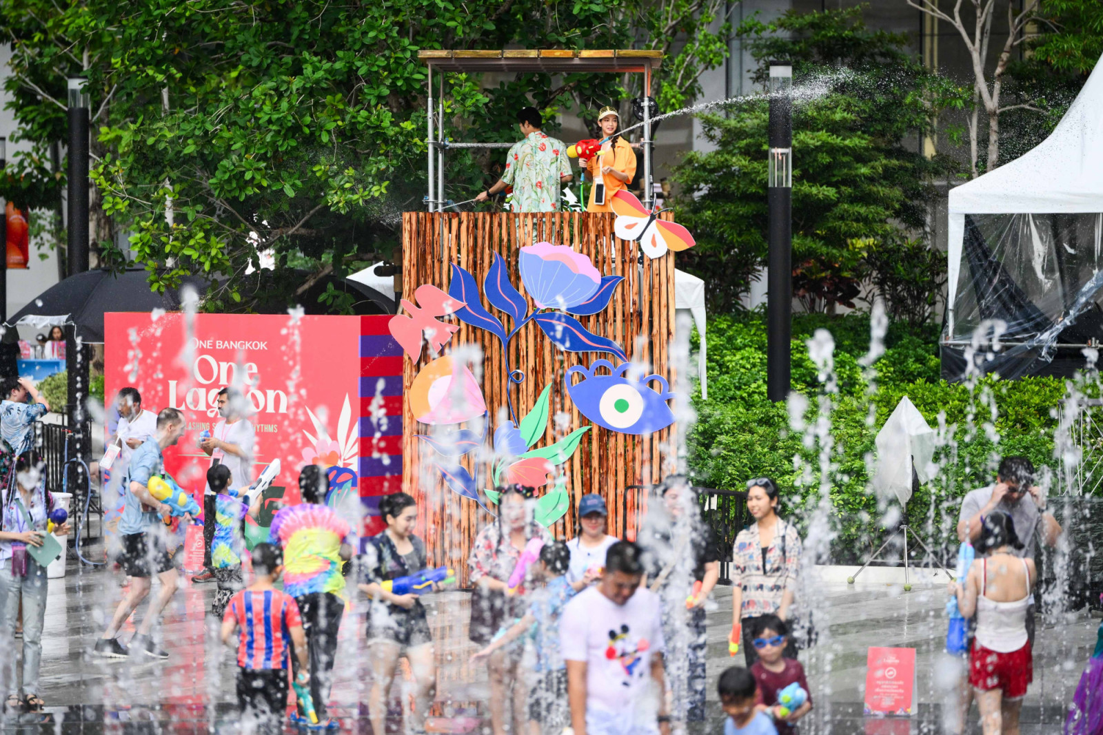 Songkran Festival at One Bangkok, where traditional rituals and water play are reimagined in a contemporary urban setting