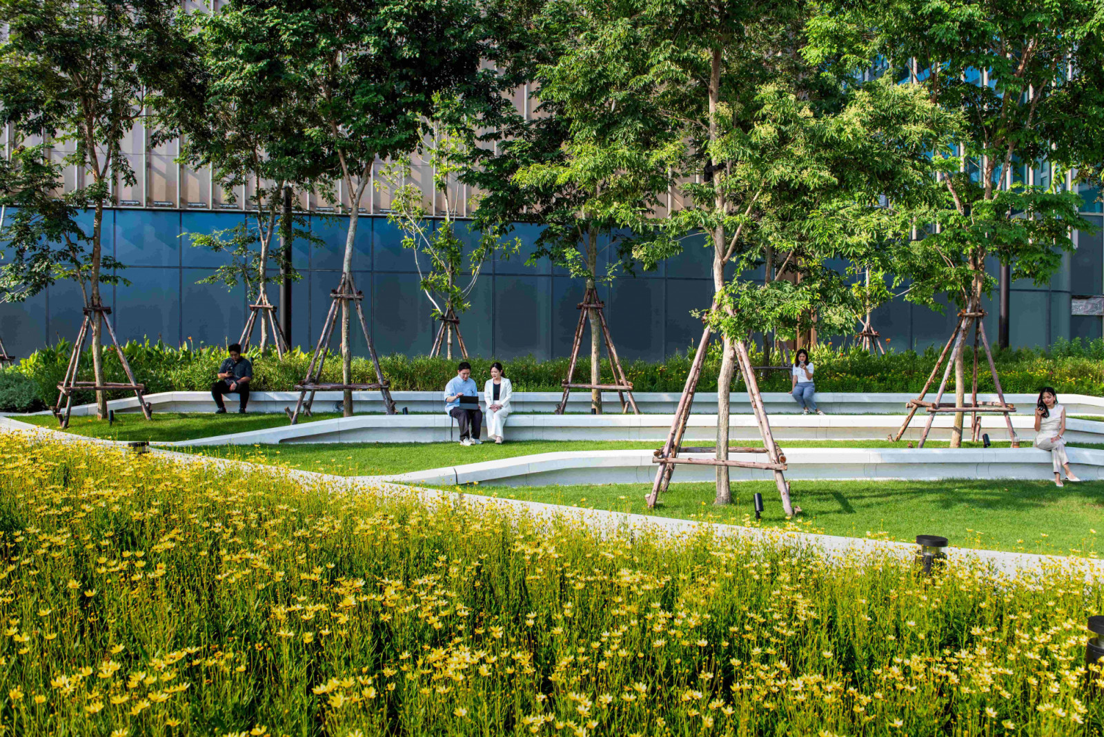 Open and green spaces at One Bangkok form a continuous network of tree-lined walkways, plazas, and gardens