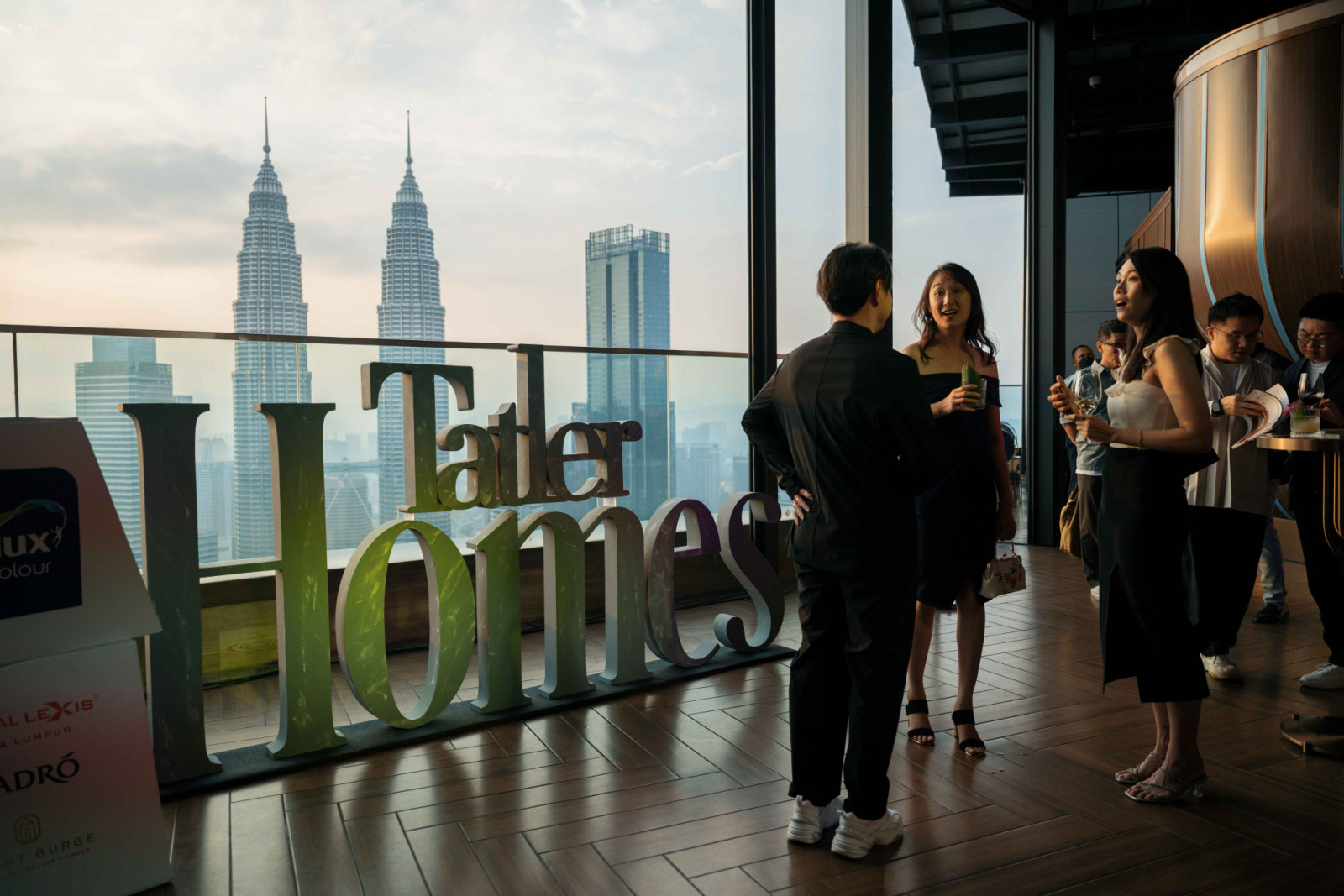 The thematic setup against the backdrop of the KL skyline