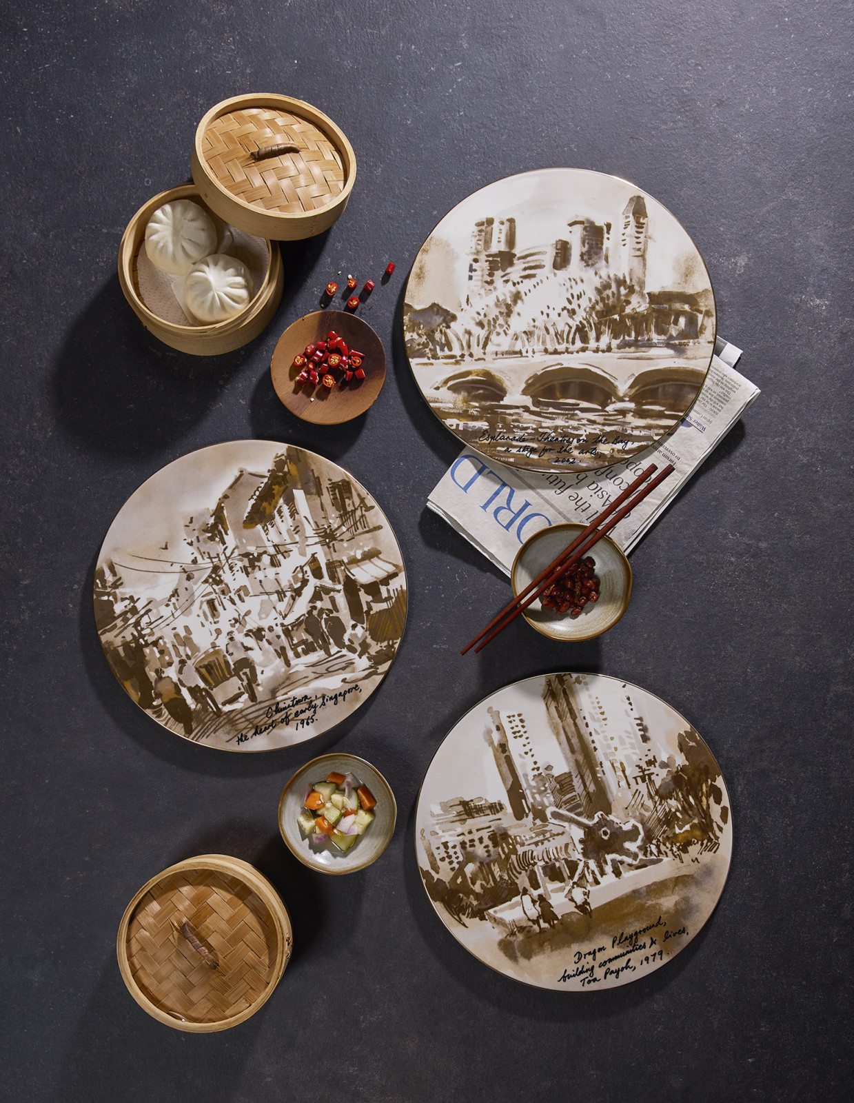 Three of the six 30cm SG60 Singapura plates featuring illustrations by Ng Woon Lam
