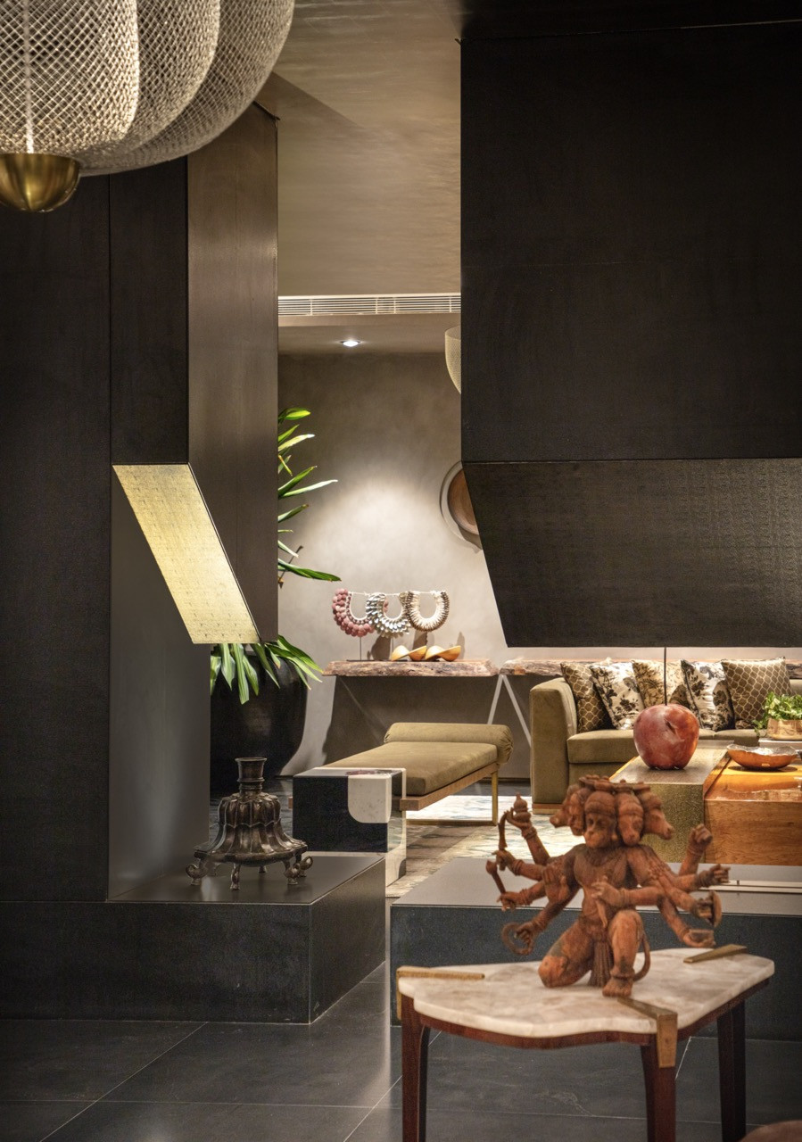 Multiple levels of the home connect through carefully planned sightlines, showing how the unconventional design creates spatial flow from active basement areas to private upper floors