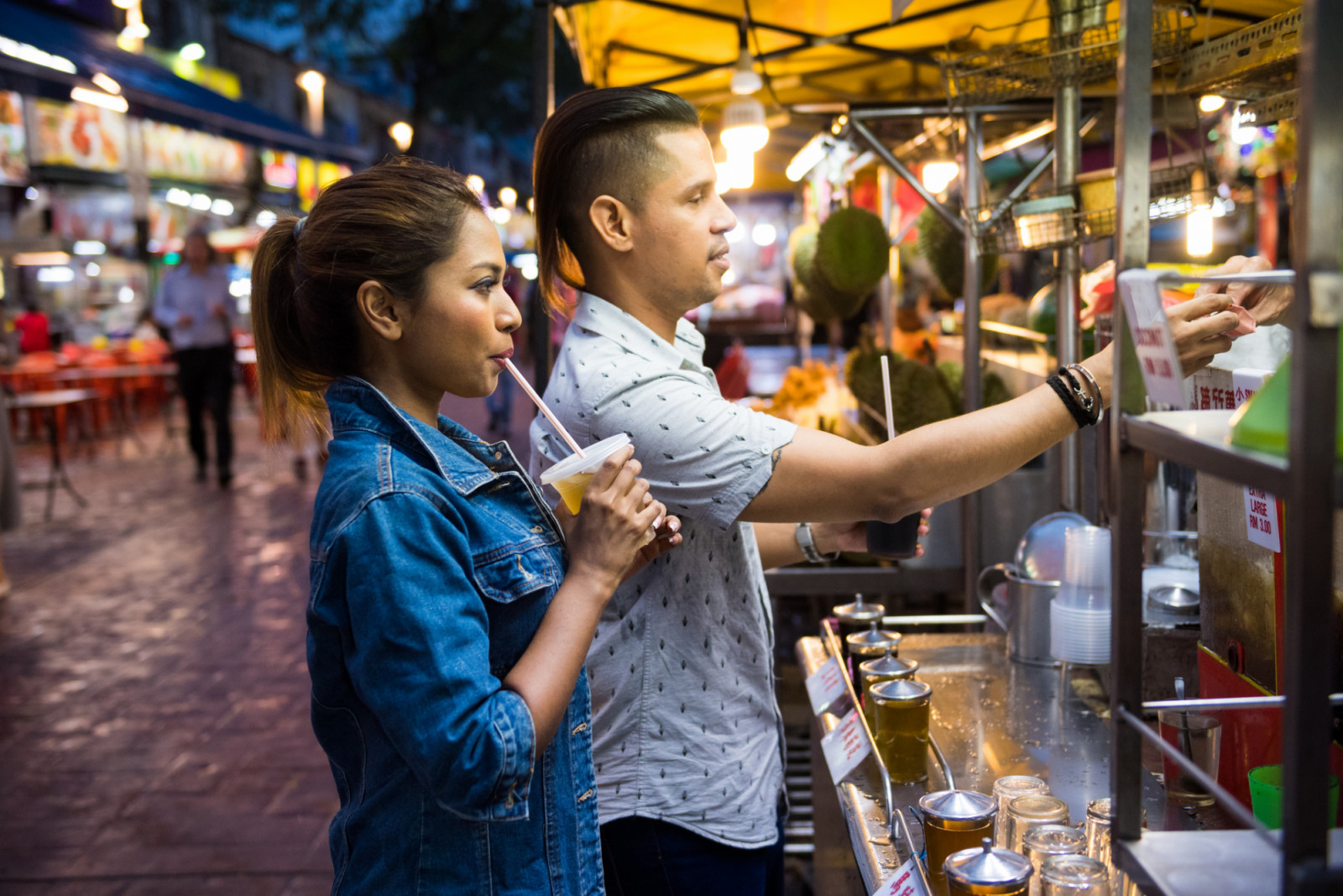 Couple enjoying local cuisine at a night market