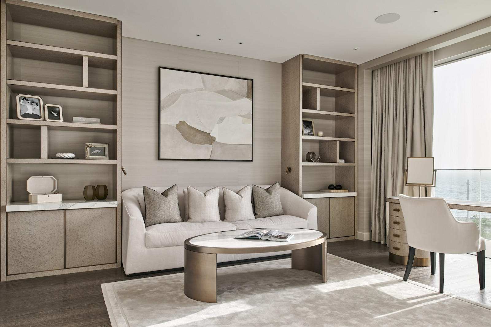 Natural light filters through the living room of this penthouse apartment on Palm Jumeirah Island, Dubai designed by Lumi Interiors