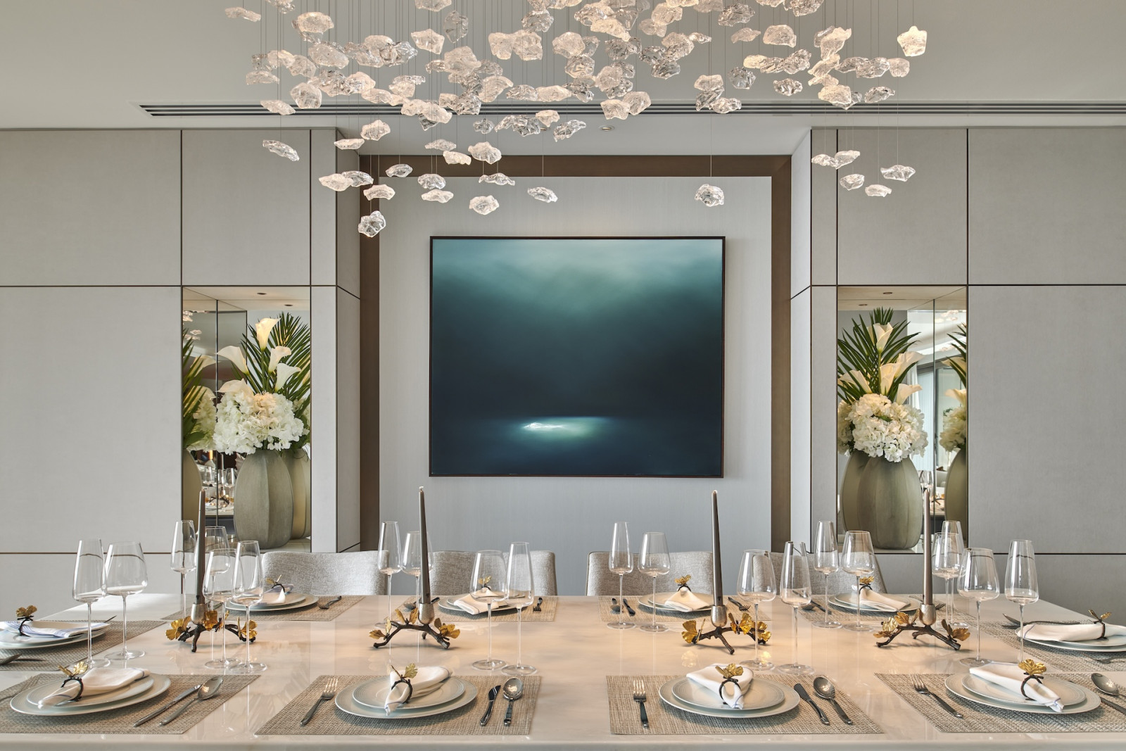 The dining room of this penthouse apartment on Palm Jumeirah Island, Dubai designed by Lumi Interiors