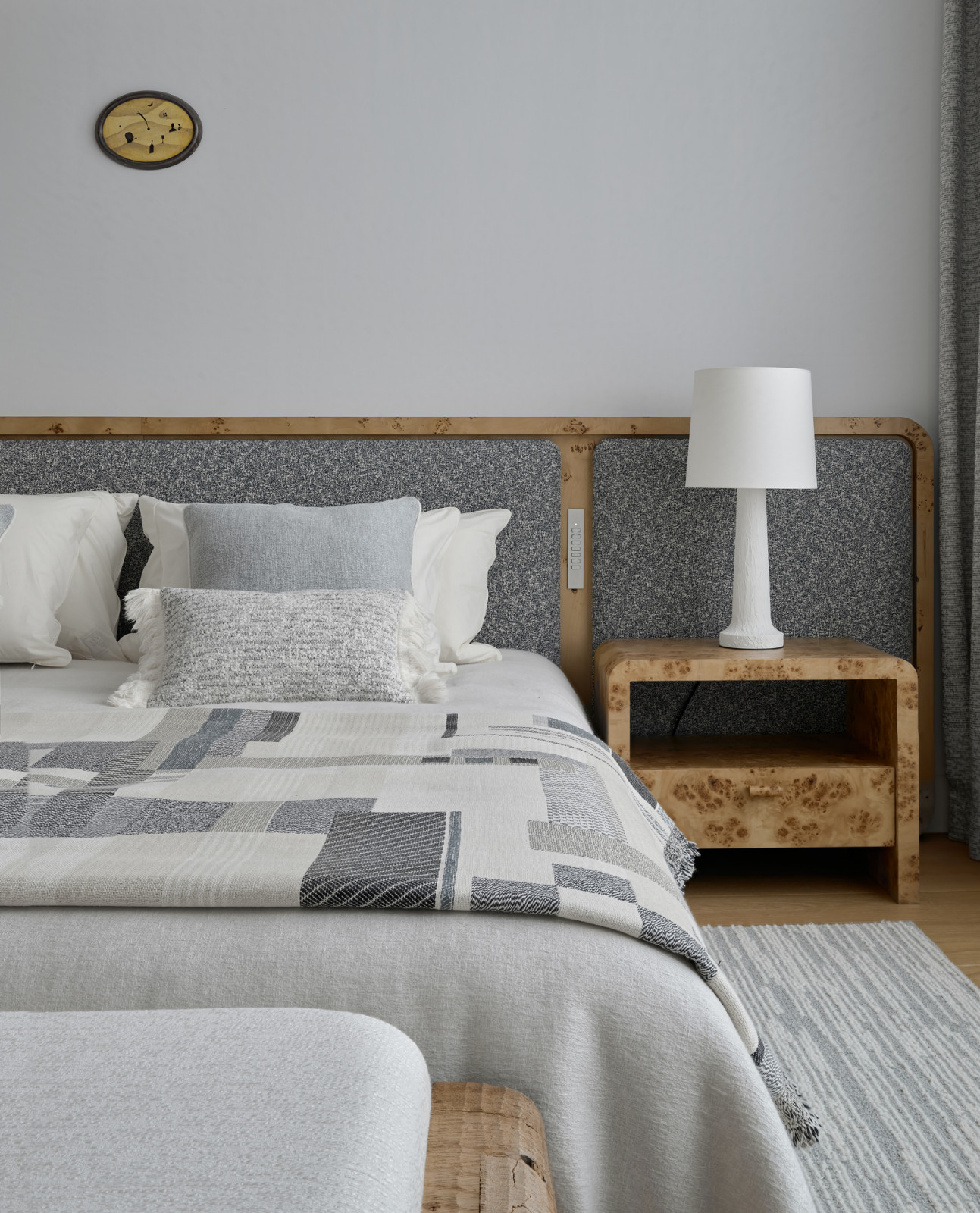 A Gilles & Boissier table lamp decorates the airy guest bedroom