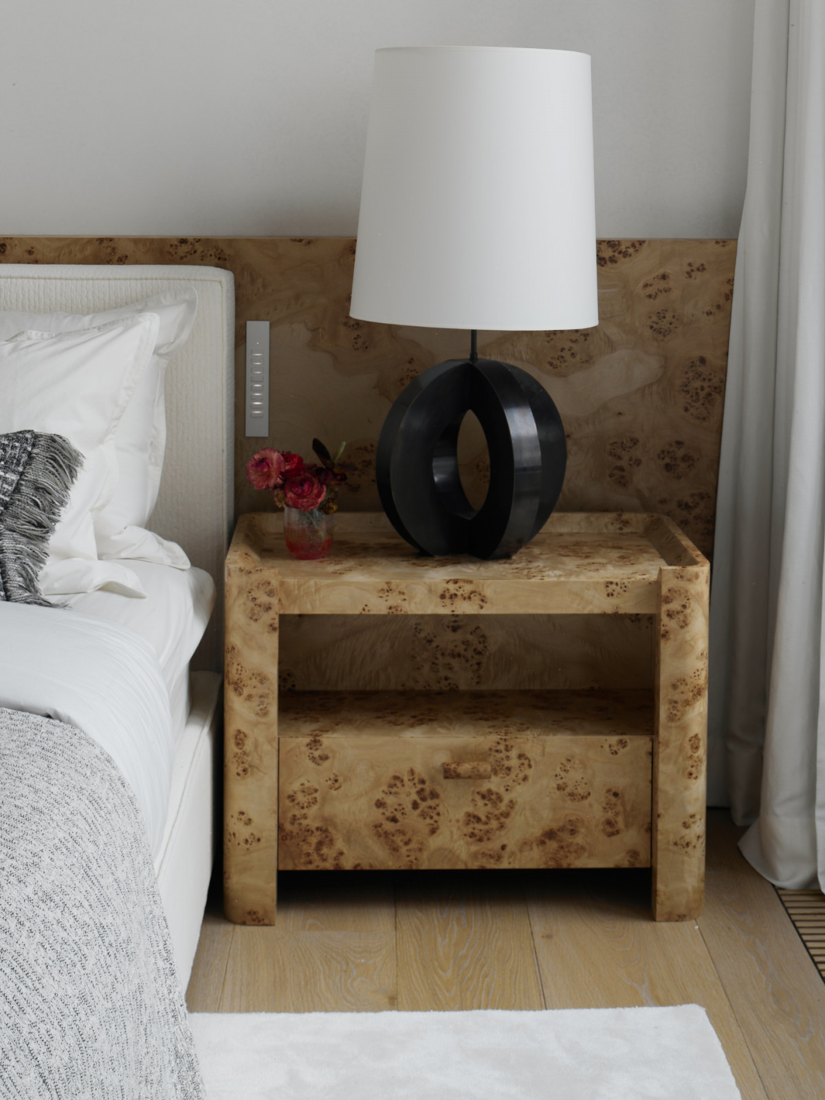 A KOSTIA table lamp accompanies the custom made bedside table
