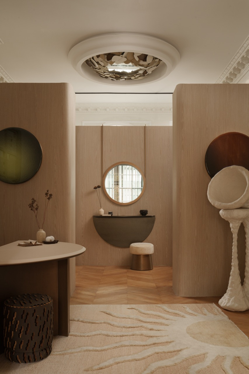 The bathroom features a stonework which is echoed throughout the apartment
