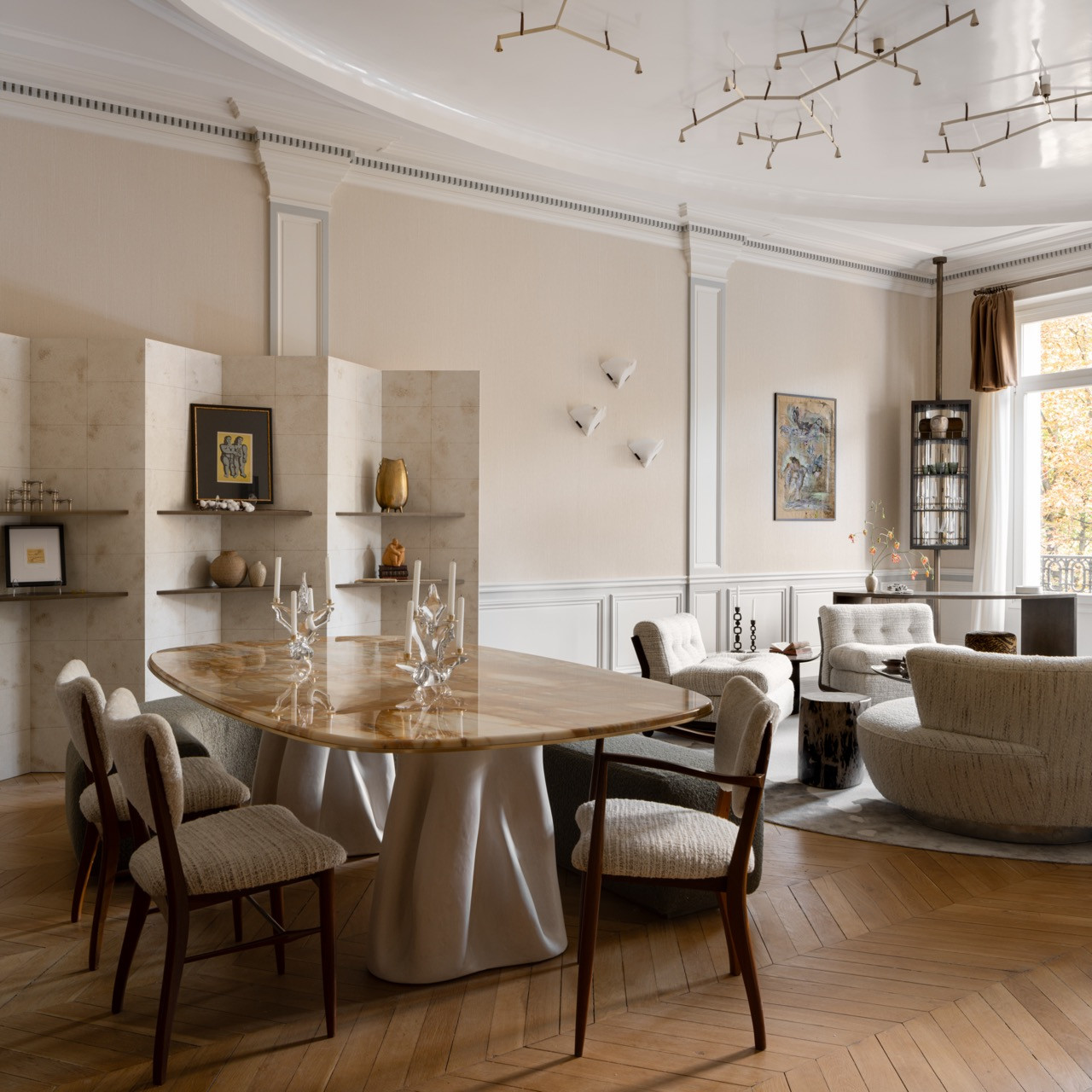 The dining area showcases the branch-like chandelier installation above custom dining furniture, embodying Ashby’s vision for a space where guests can enjoy a cheerful celebration at the table