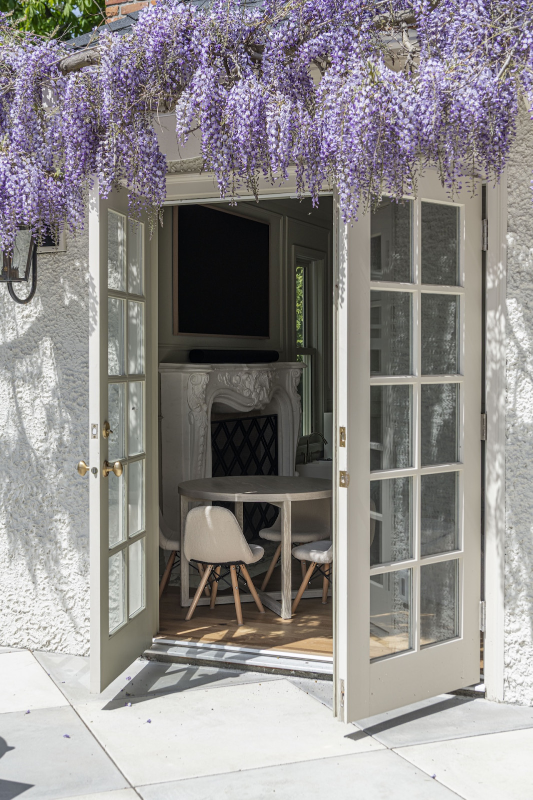 Climbing wisteria in the back garden of a restored Victoria, British Columbia home, designed by Lauren Kyle McDavid for NHL player Tyson Barrie