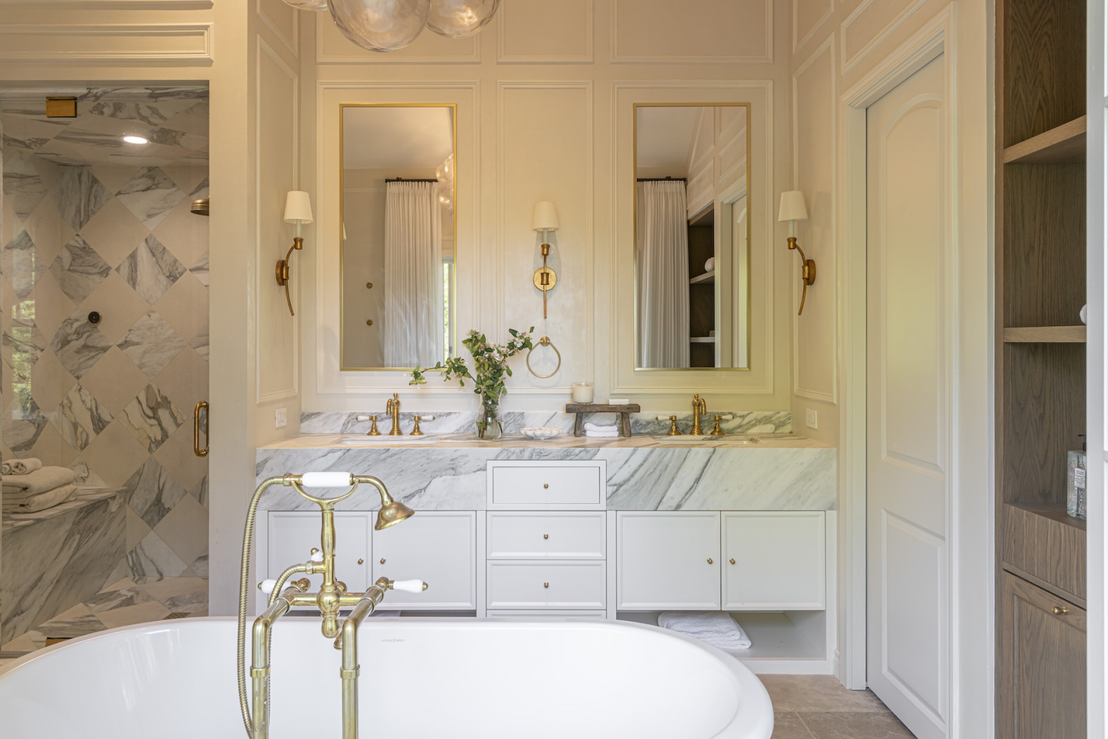The primary suite bathroom in a restored Victoria, British Columbia home, designed by Lauren Kyle McDavid for NHL player Tyson Barrie