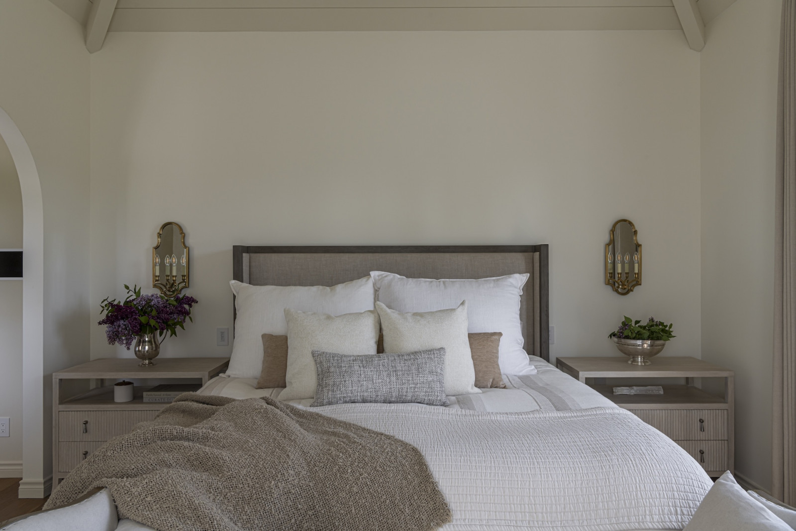 The primary suite of a restored Victoria, British Columbia home, designed by Lauren Kyle McDavid for NHL player Tyson Barrie