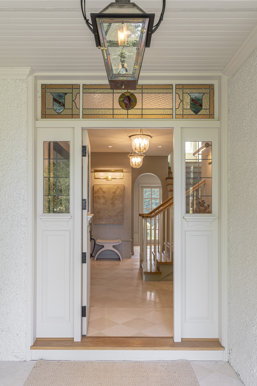The entryway of a restored Victoria, British Columbia home, designed by Lauren Kyle McDavid for NHL player Tyson Barrie