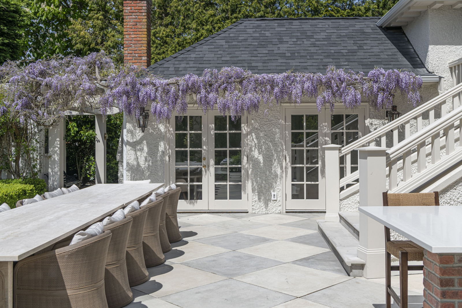 Climbing wisteria in the back garden of a restored Victoria, British Columbia home, designed by Lauren Kyle McDavid for NHL player Tyson Barrie