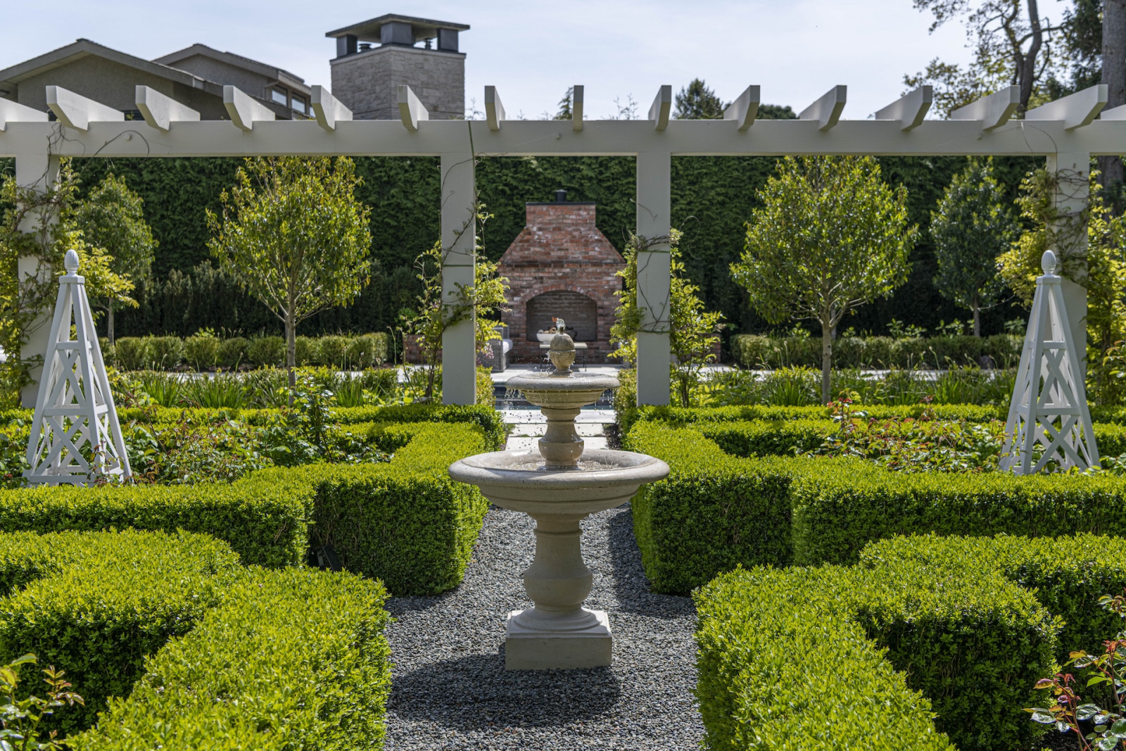 The back garden of a restored Victoria, British Columbia home, designed by Lauren Kyle McDavid for NHL player Tyson Barrie