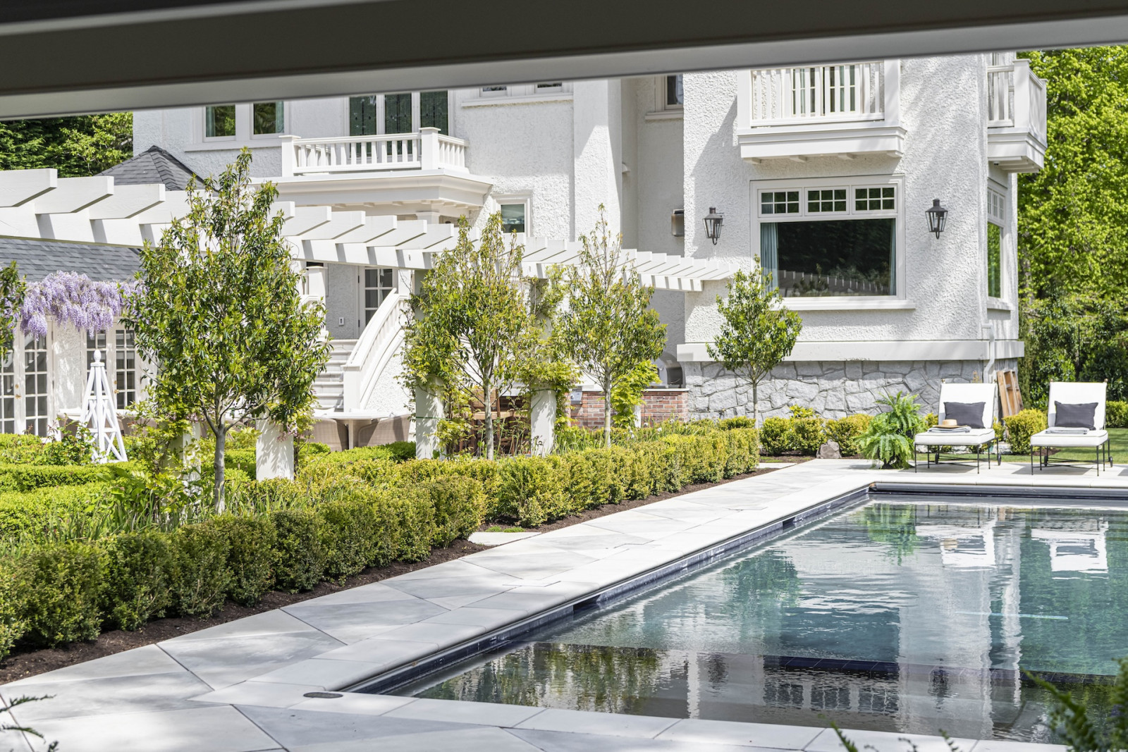 The back gaarden of a restored Victoria, British Columbia home, designed by Lauren Kyle McDavid for NHL player Tyson Barrie