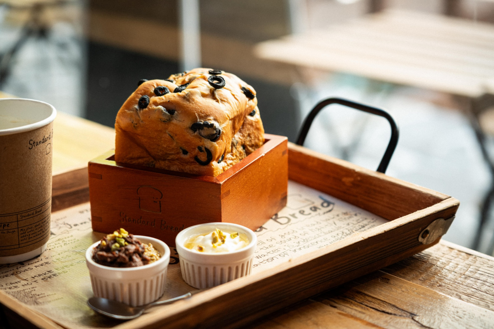 Standard Bread is a cult Korean bakery’s signature Black Olive Bread, and artisanal offerings represent a masterclass in elevated comfort food Weave at Resorts World Sentosa