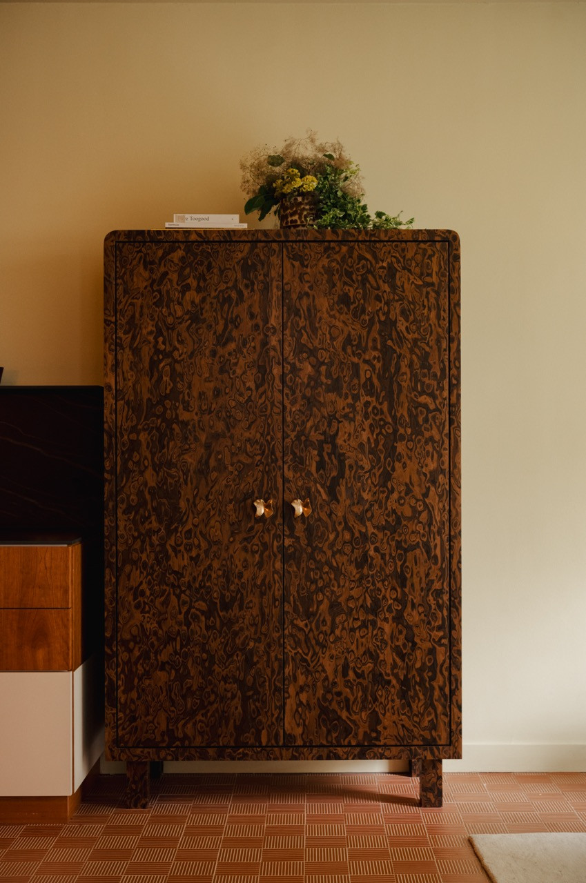 The closed cabinet shows the full beauty of the California burl veneer, a material choice that exemplifies the eclectic approach both designer and client embraced for this Bangsar flat.