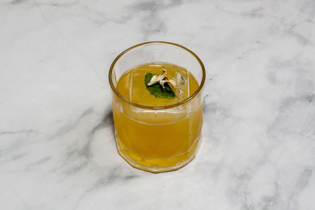 The cocktail ''Penicillin'' is sitting on a bright background. (Photo by Seung-il Ryu/NurPhoto via Getty Images)