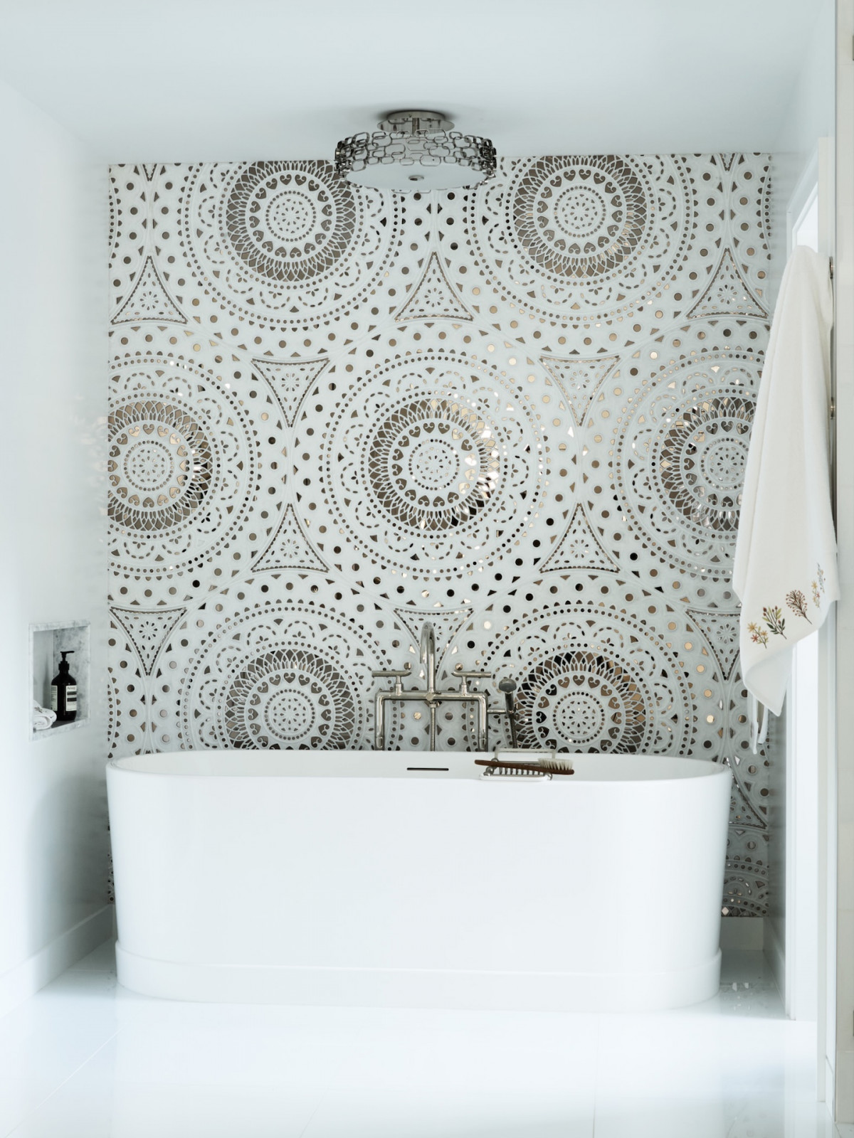 The primary spa bathroom in a maximalist 1920s Georgian home in Boston that blends Mexican and Indian influences, designed by Vani Sayeed Studio