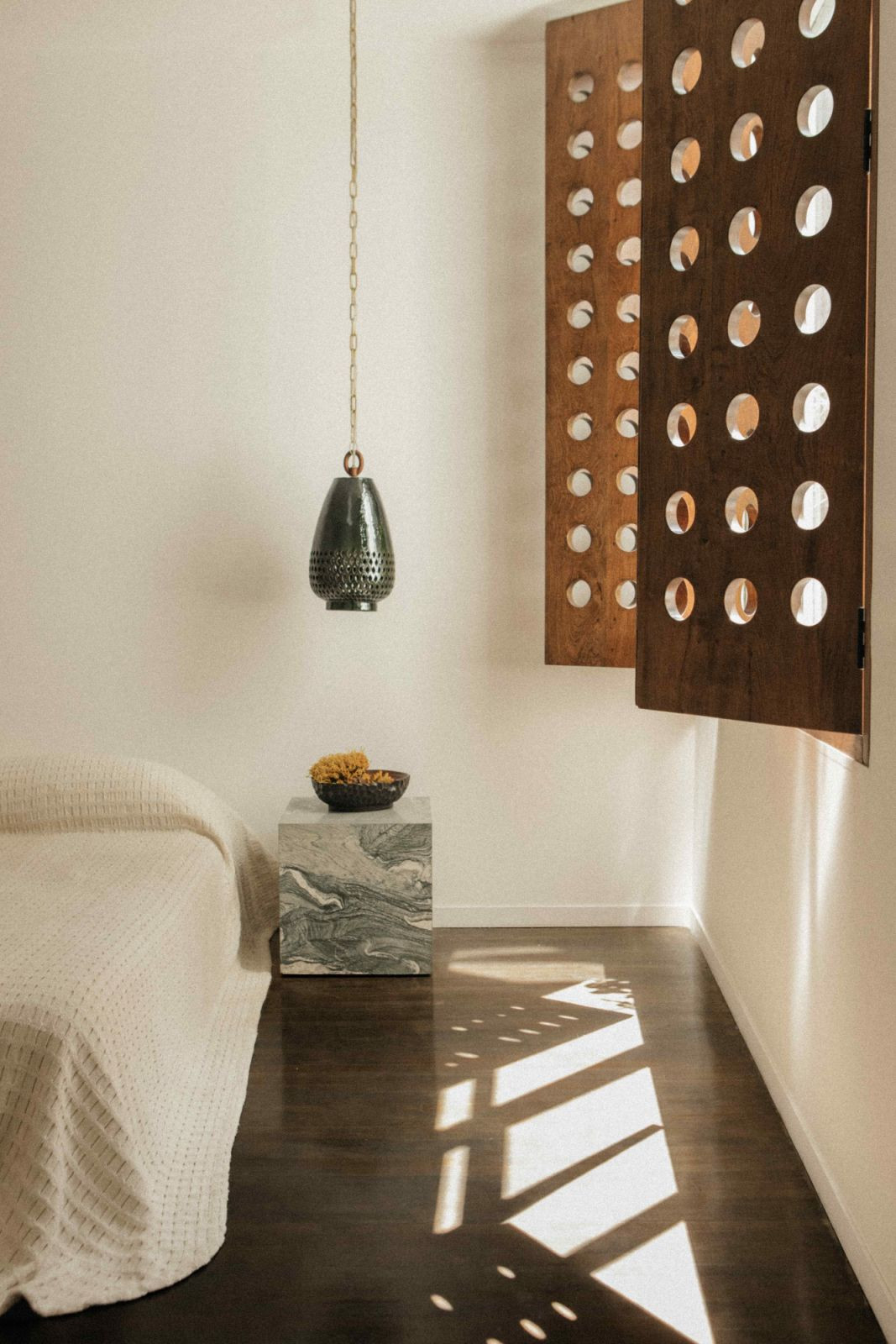 The perforated bronze panels in the bedroom are reminiscent of the rhythms of Mexican life (Photo: Maureen M Evans)
