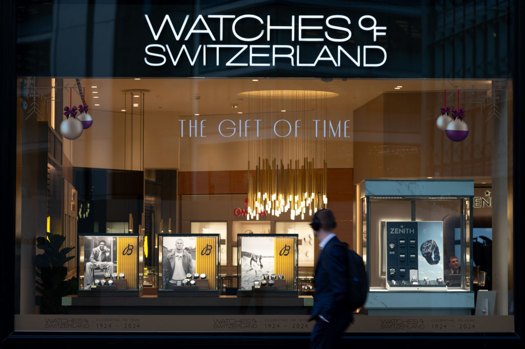 LONDON, ENGLAND - NOVEMBER 25: A man looks at luxury watches in a Watches of Switzerland shop window on November 25, 2024 in London, United Kingdom. (Photo by John Keeble/Getty Images)