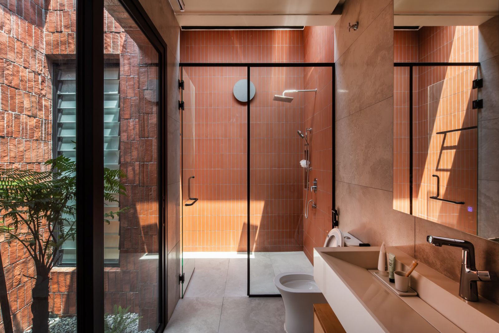 Skylights and floor-to-ceiling glass doors allow for ample light and cross ventilation (Photo: Ameen Deen)